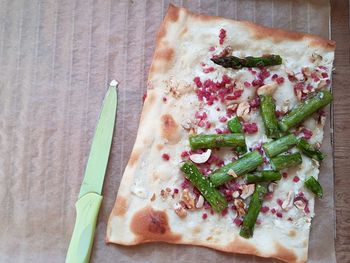 High angle view of pizza served on table