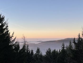 Scenic view of silhouette mountains against sky at sunset