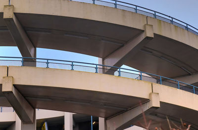 Low angle view of elevated walkway against building