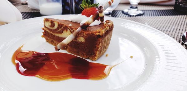 Close-up of cake served in plate on table