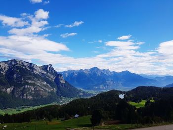 Scenic view of landscape and mountains against sky