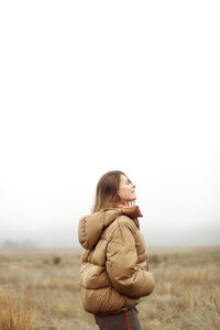 Portrait of young woman smiling outdoors