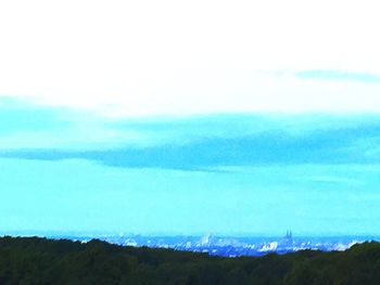 Scenic view of landscape against blue sky