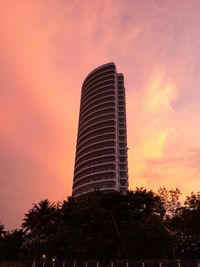 Low angle view of building against sky during sunset