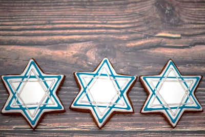 Delicious festive hanukkah cookies for celebrating on a wooden background at home. close-up.