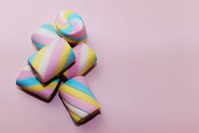 Close-up of multi colored pencils over white background