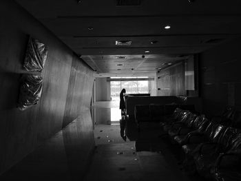 Man in corridor of building
