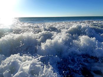 Scenic view of sea against clear blue sky