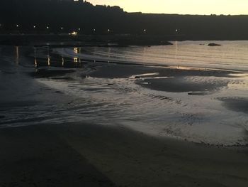 Scenic view of beach at sunset