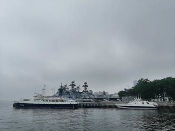 Ship moored in sea against sky