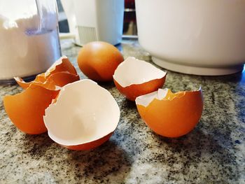 Close-up of orange eggs in plate