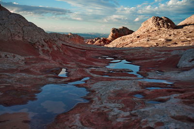 Scenic view of snowcapped mountains against sky during sunset