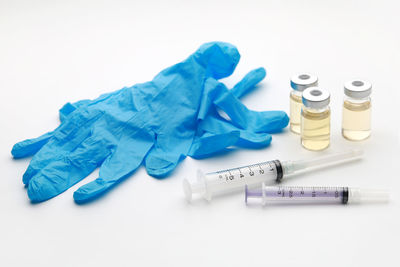 High angle view of objects on table against white background