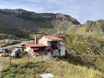 Houses and mountains against sky
