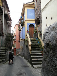 Steps amidst buildings in city