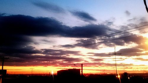 Low angle view of cloudy sky at sunset