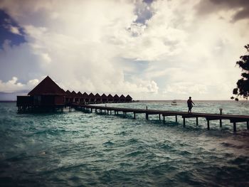 View of jetty at calm blue sea