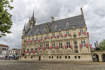 Famous city hall of gouda town by day in the netherlands.