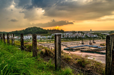 Scenic view of field against sky during sunset