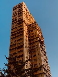 Low angle view of buildings against blue sky