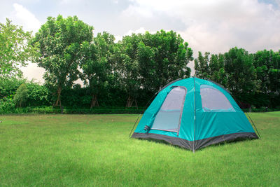 Tent in field against sky