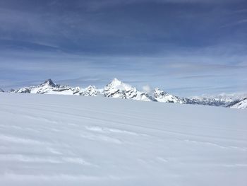 Snow covered mountain against sky
