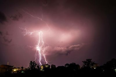 Low angle view of lightning in sky at night