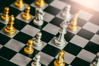 High angle view of chess pieces on board