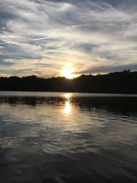 Scenic view of lake at sunset