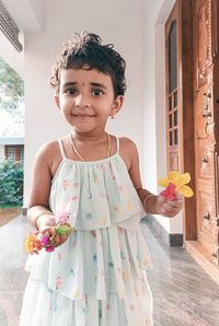 Portrait of cute girl with bouquet