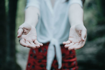 Midsection of woman holding hands