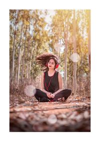 Portrait of young woman sitting outdoors