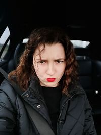 Beautiful woman sitting in car