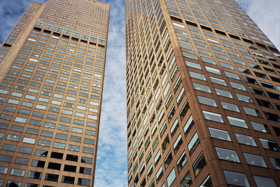 Low angle view of modern buildings against sky