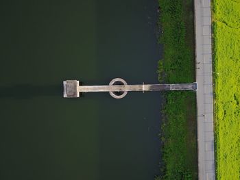 Aerial view of pier in lake by road 