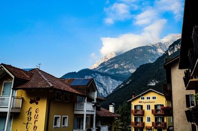 Buildings in city against sky during winter