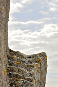 Low angle view of rock against sky