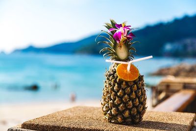 Close-up of drink served in pineapple