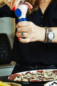 Midsection of woman holding food