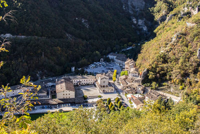 High angle view of buildings and trees in village