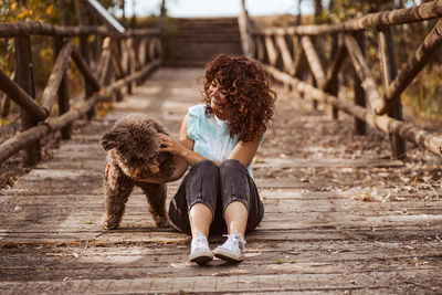 Rear view of woman with dog