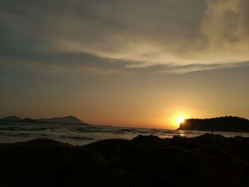 Scenic view of beach at sunset