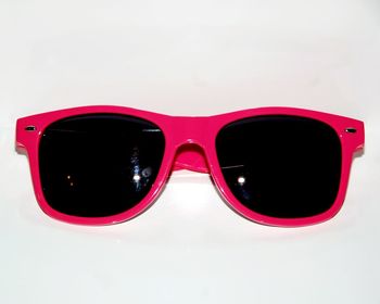 Close-up of sunglasses over white background