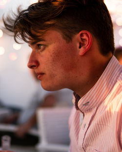 Portrait of young man looking away