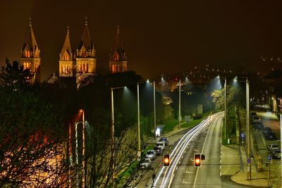 High angle view of city street and buildings at night