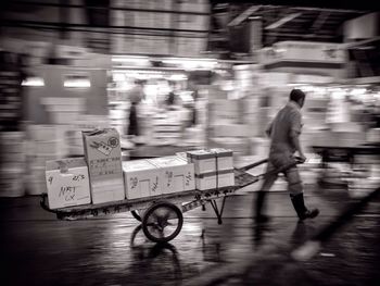 Blurred motion of woman in city