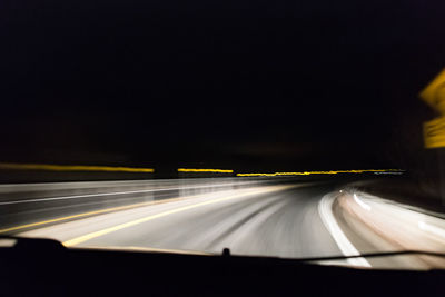 Light trails on road at night