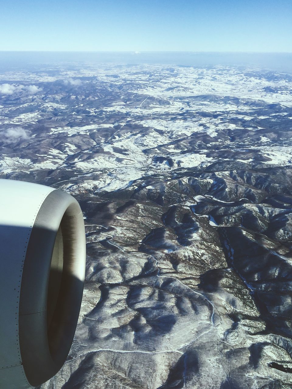 CLOSE-UP OF AIRPLANE WING AGAINST THE SKY