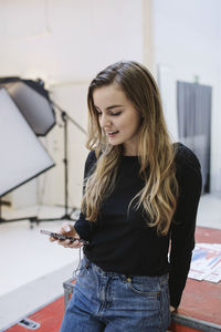 Beautiful young woman looking at camera