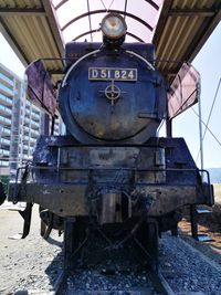 Low angle view of abandoned train on railroad tracks